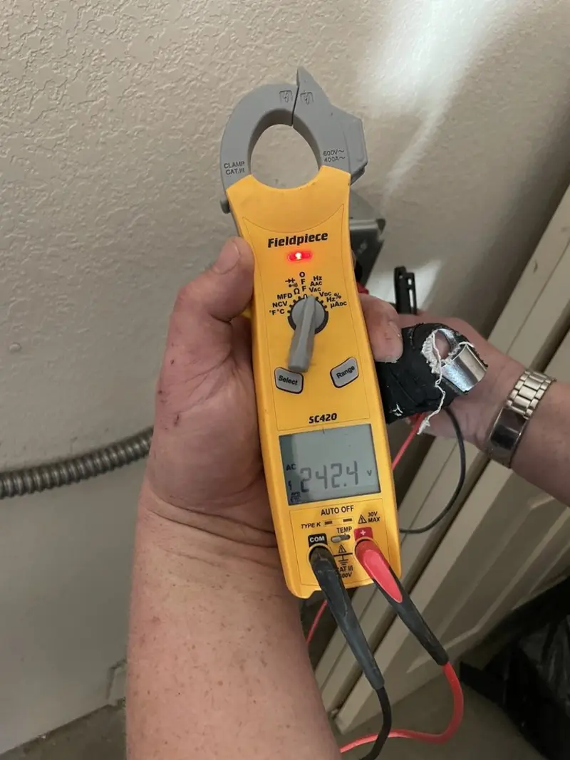 Voltage testing with clamp meter during Outlet Installation in Swampscott